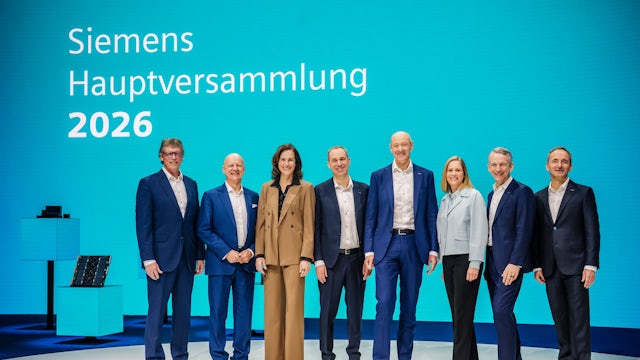 Photo of Siemens annual shareholder meeting being broadcast.