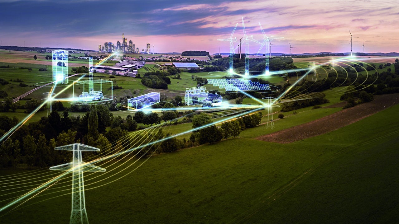 City in the background and various power distribution systems in the foreground.