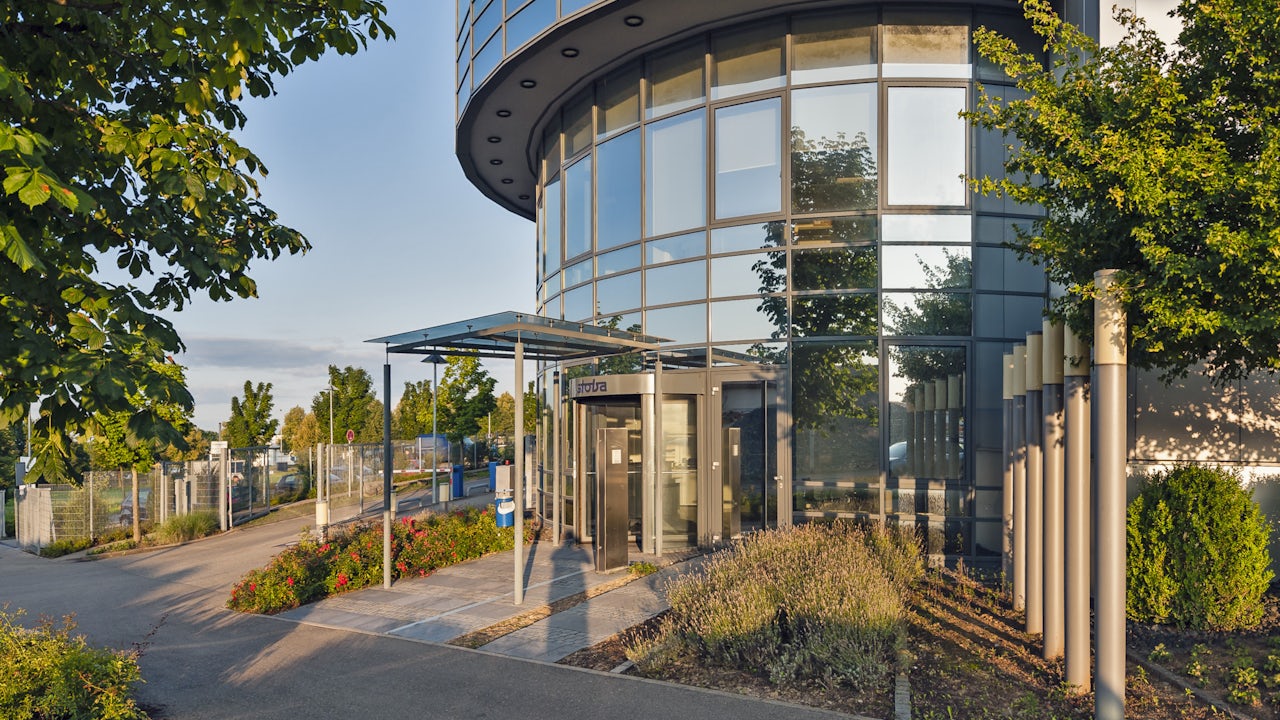 A building with a tower and a clock on the side of the tower.