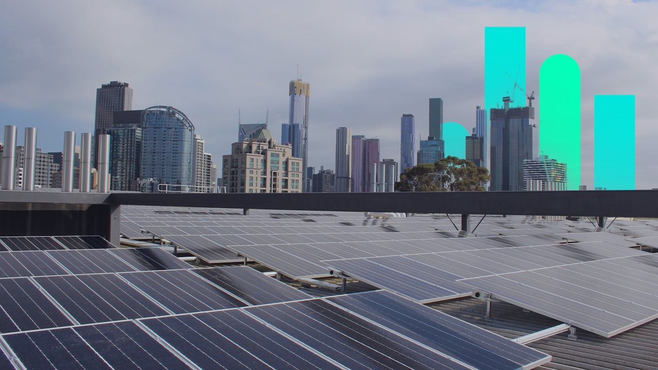 The image shows a person standing in front of a large screen displaying a brand campaign.