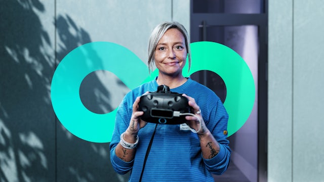 Woman holding a VR headset.