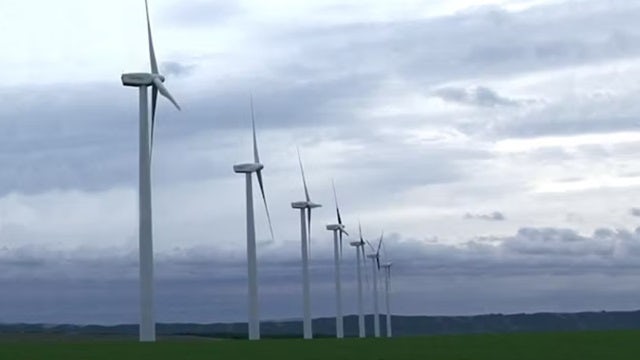 A wind turbine farm with multiple wind turbines generating electricity.