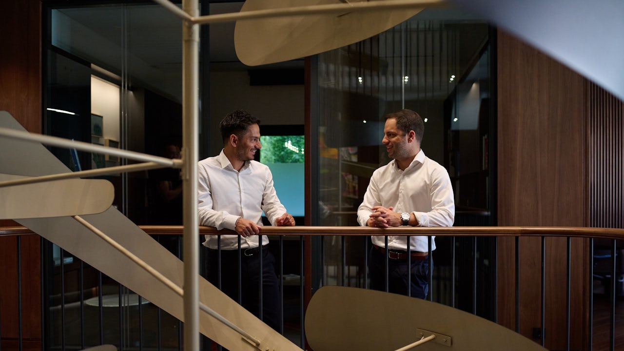 Two men in the Prodea Athens talking.