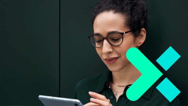 Woman reading tablet with Siemens Xcelerator logo superimposed