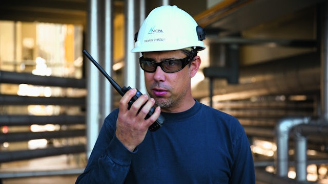 Engineer talking through a radio