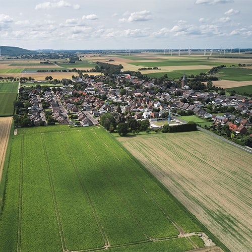 Aerial Still of Rural Village and Landscape.