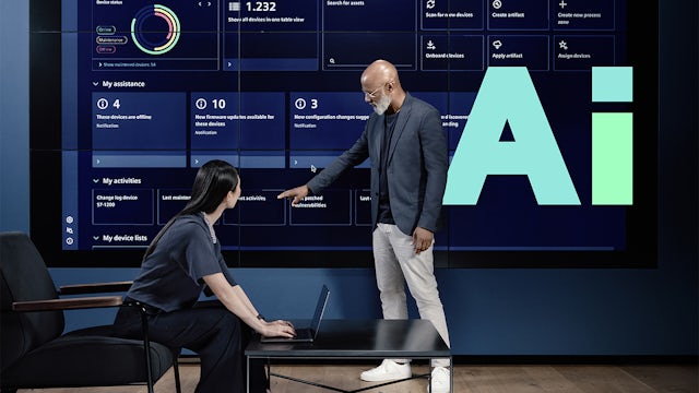 Person using laptop with holographic display of data charts and graphs floating above