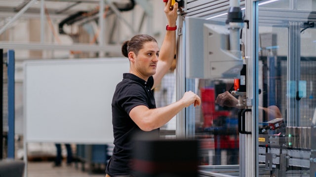An automation engineer working in a factory in Chemnitz, Germany. 