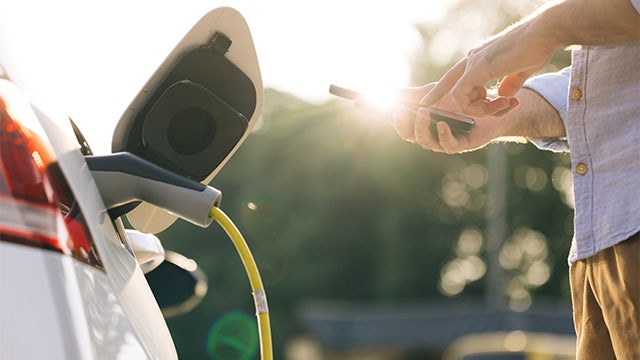 An image of a book cover with a car and a battery symbol on it.