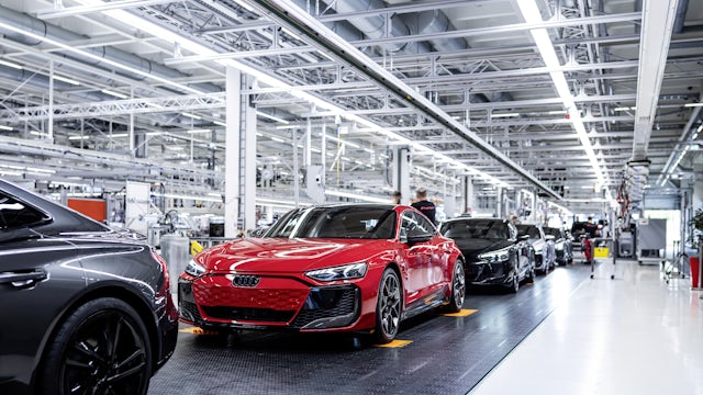Finished Audis rolling off the assembly line.