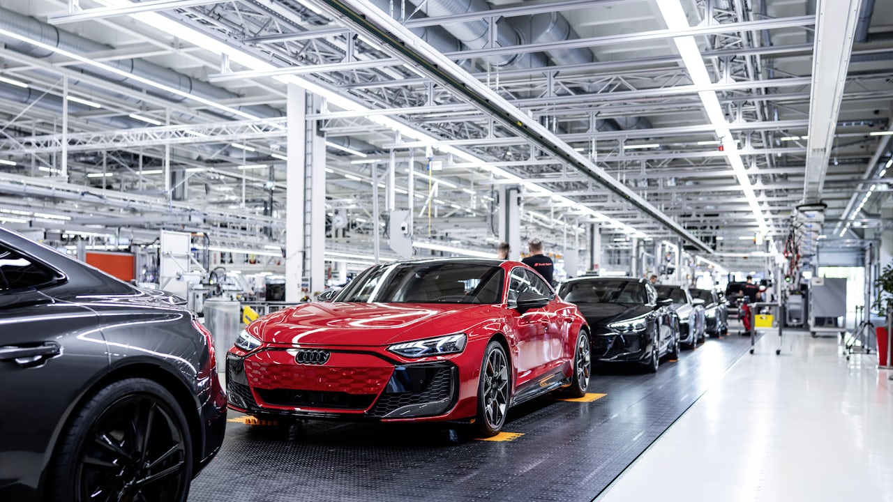 Finished Audis rolling off the assembly line.
