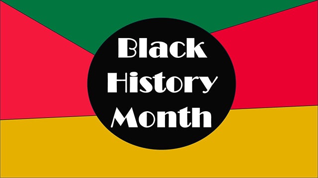 A black and white photo of a person with a serious expression, possibly a historical figure, with a spotlight on them.