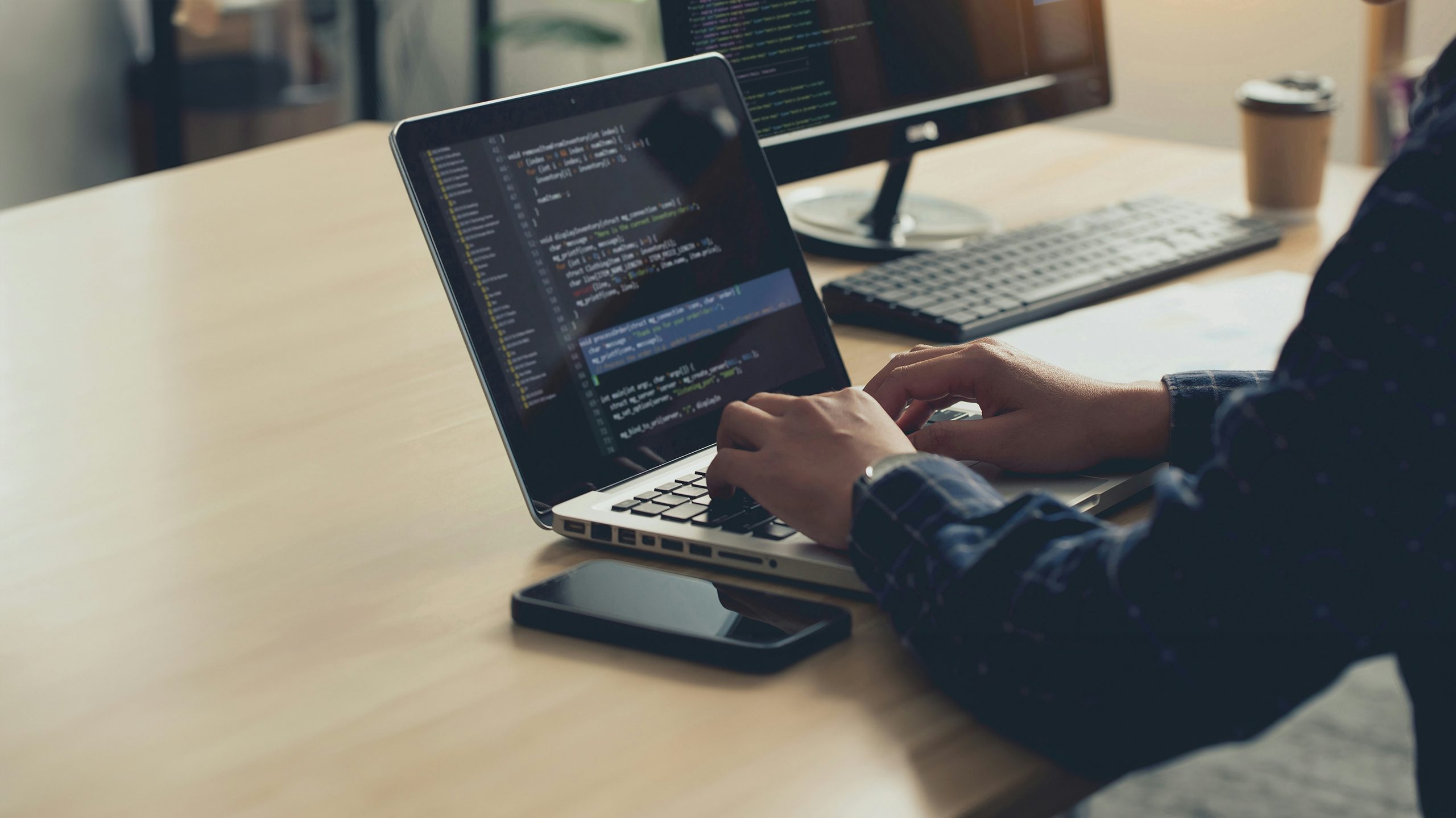 Man working at laptop exploring Building X API connections.