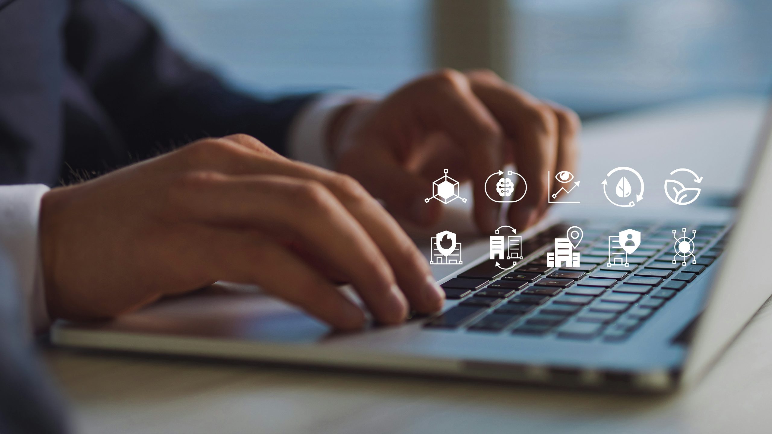 Man working at a laptop exploring the AI-based applications from Building X.