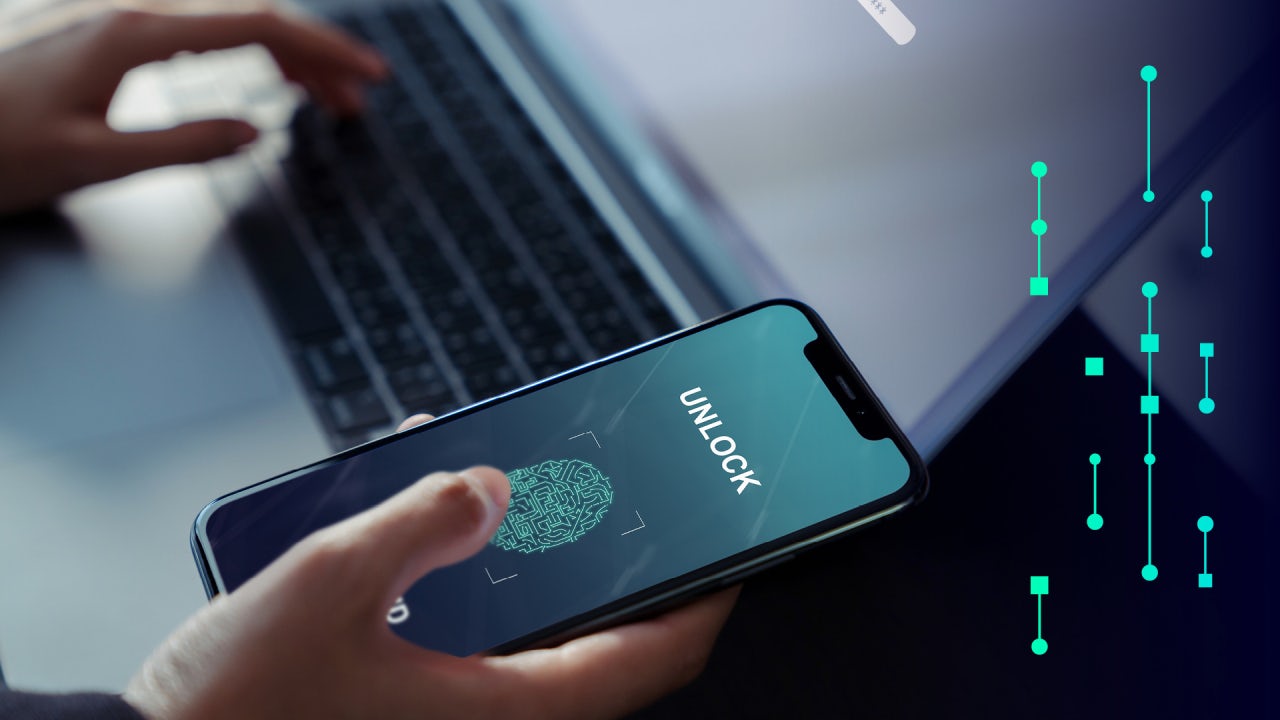 Someone unlocking a phone with a fingerprint