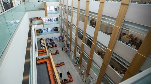 Interior view of a colorful educational building (University of Toronto Scarborough Campus) with a large atrium.