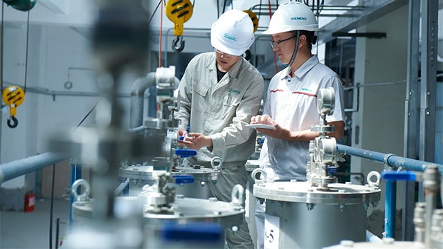 Two professionals working in a lab