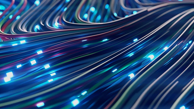 A person is working on a computer with a Siemens supplier portal open on the screen.