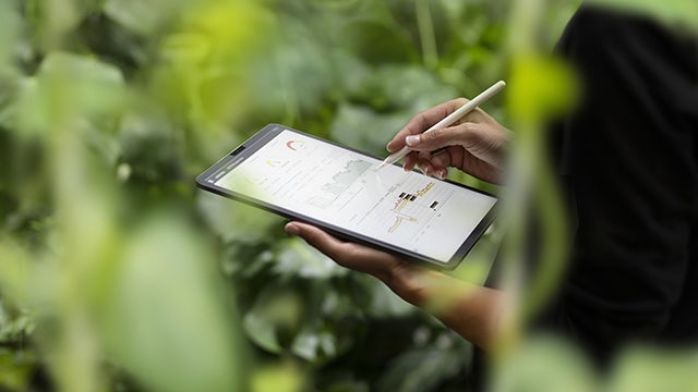 A tablet displaying a webpage about Siemens' code of conduct.