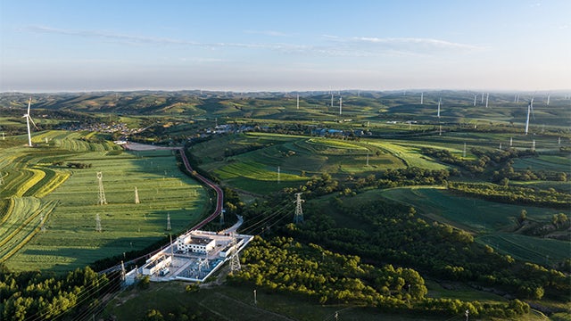 Green fields and windmills.