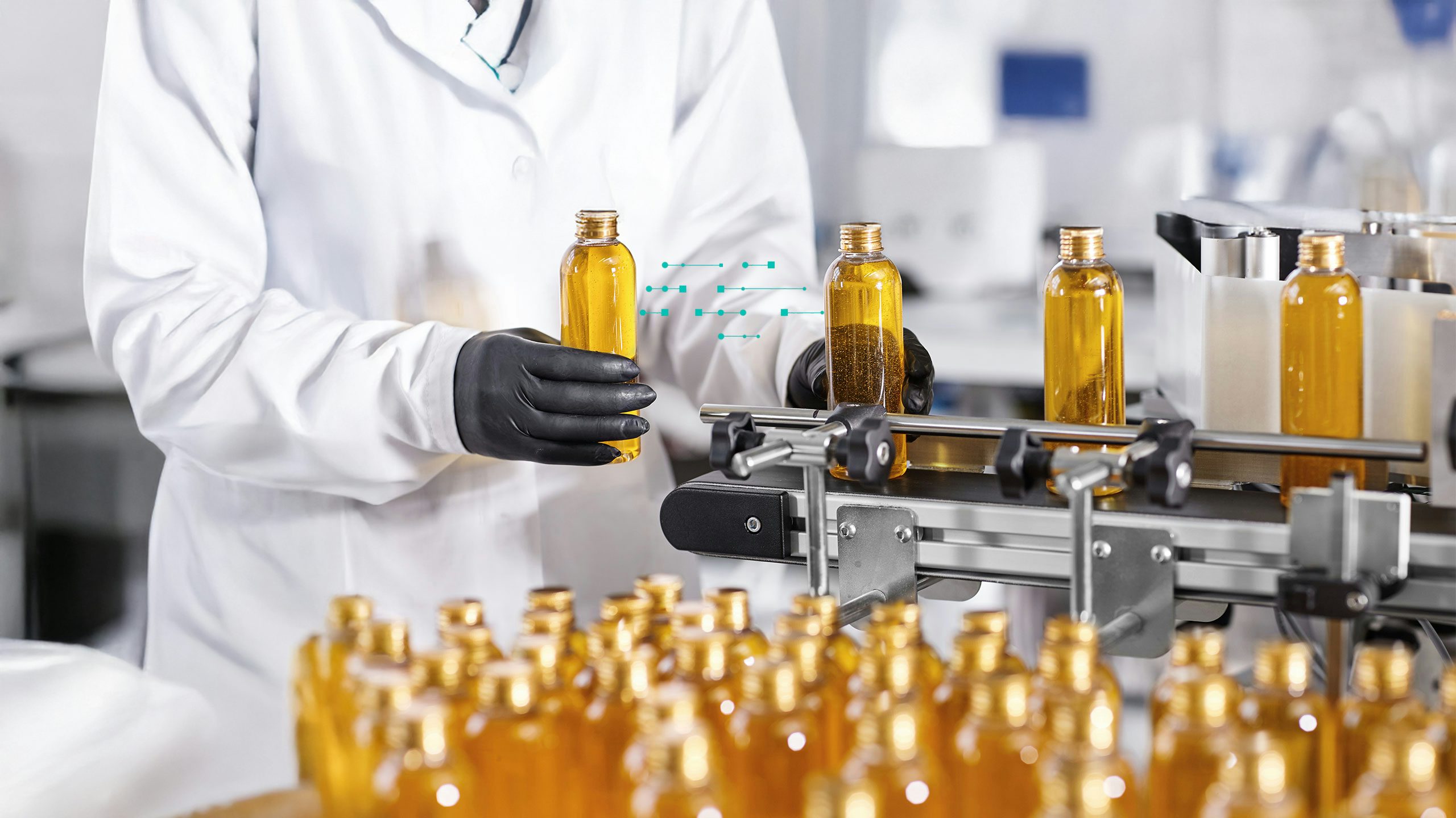 Worker in lab coat and gloves holds a bottle of yellow liquid on a smart factory conveyor belt with digital data overlay.