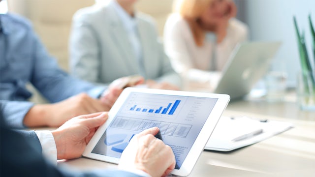 Industry consultant presenting strategic insights and data analytics during consumer goods transformation planning session.