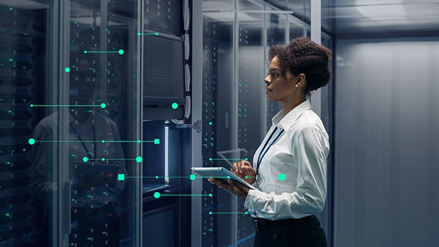 A cybersecurity image featuring a person in a suit and tie with a computer screen displaying a padlock symbol.