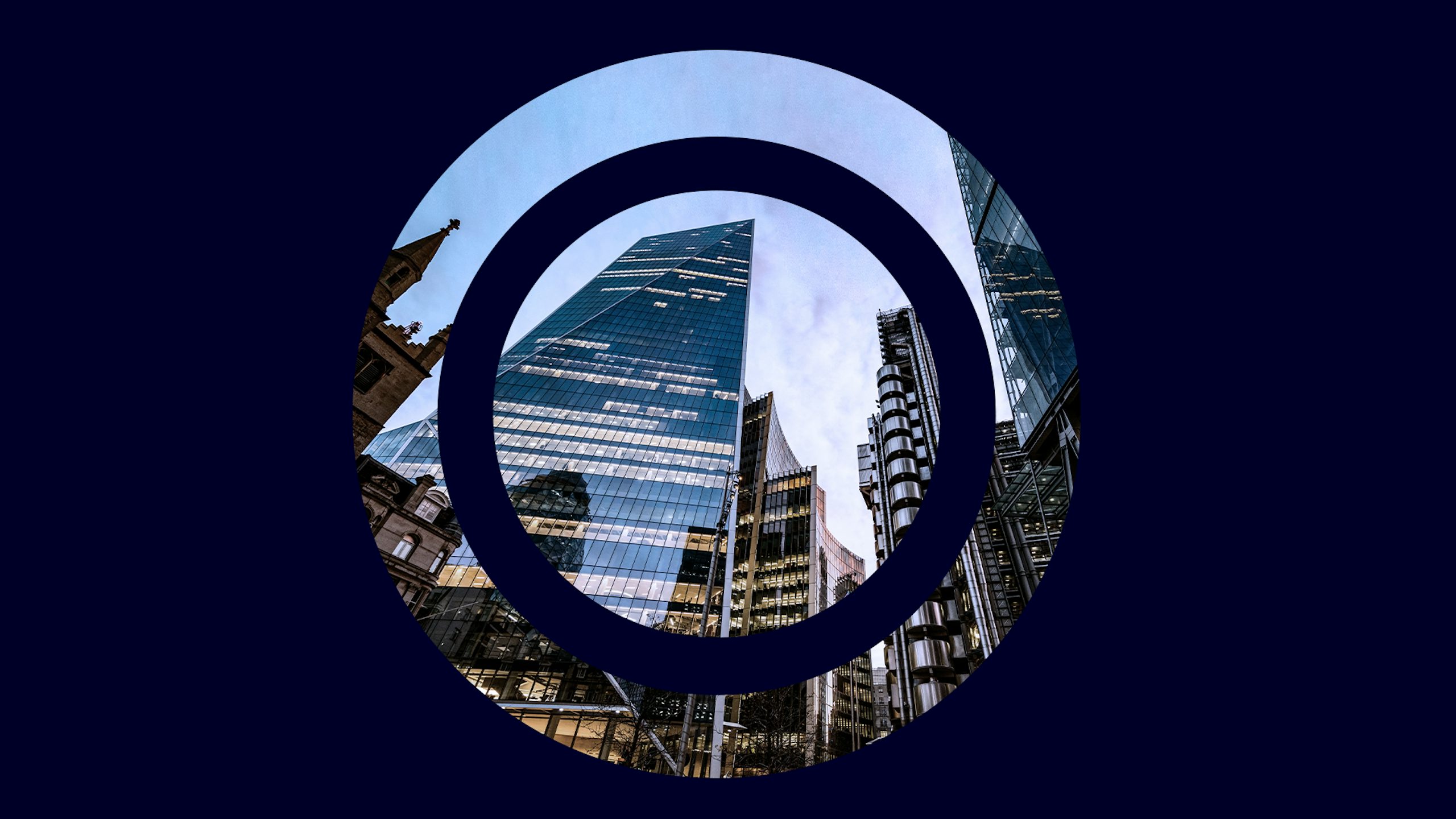Dark blue background with circular target cut out, through which is an image of skyscrapers against a blue sky.