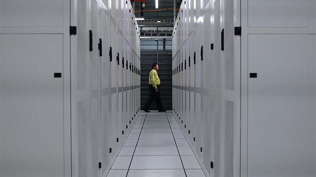 Person walking in a data center facility.   