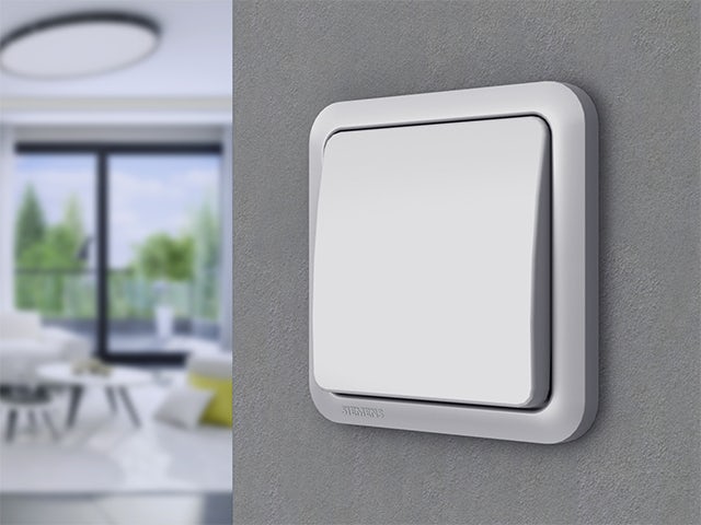 A promotional image for Delta Profil switch and socket program with a white background and a product image in the center.