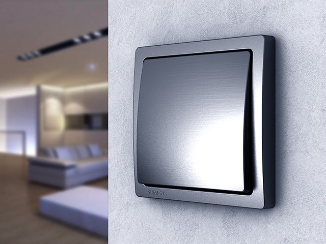 A promotional image for a Delta style switch and socket program, featuring a modern electrical outlet with a switch.