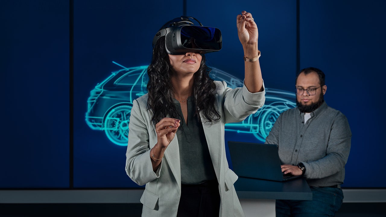 A digital twin technology illustration showing a person in a safety helmet and a digital twin representation of a factory.