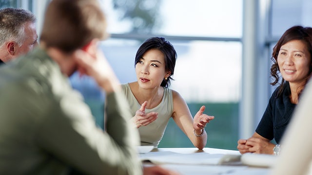 This is a group of office professionals collaborating in an office.