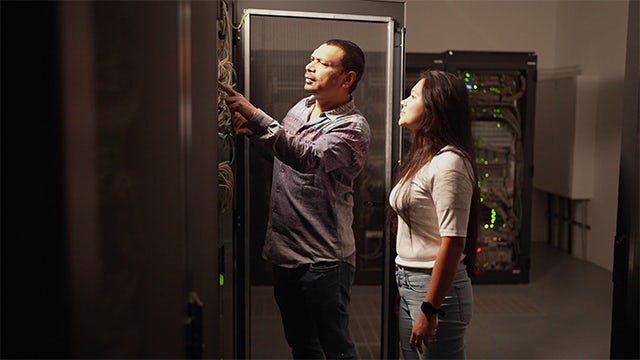 Workers looking at entiretec security.