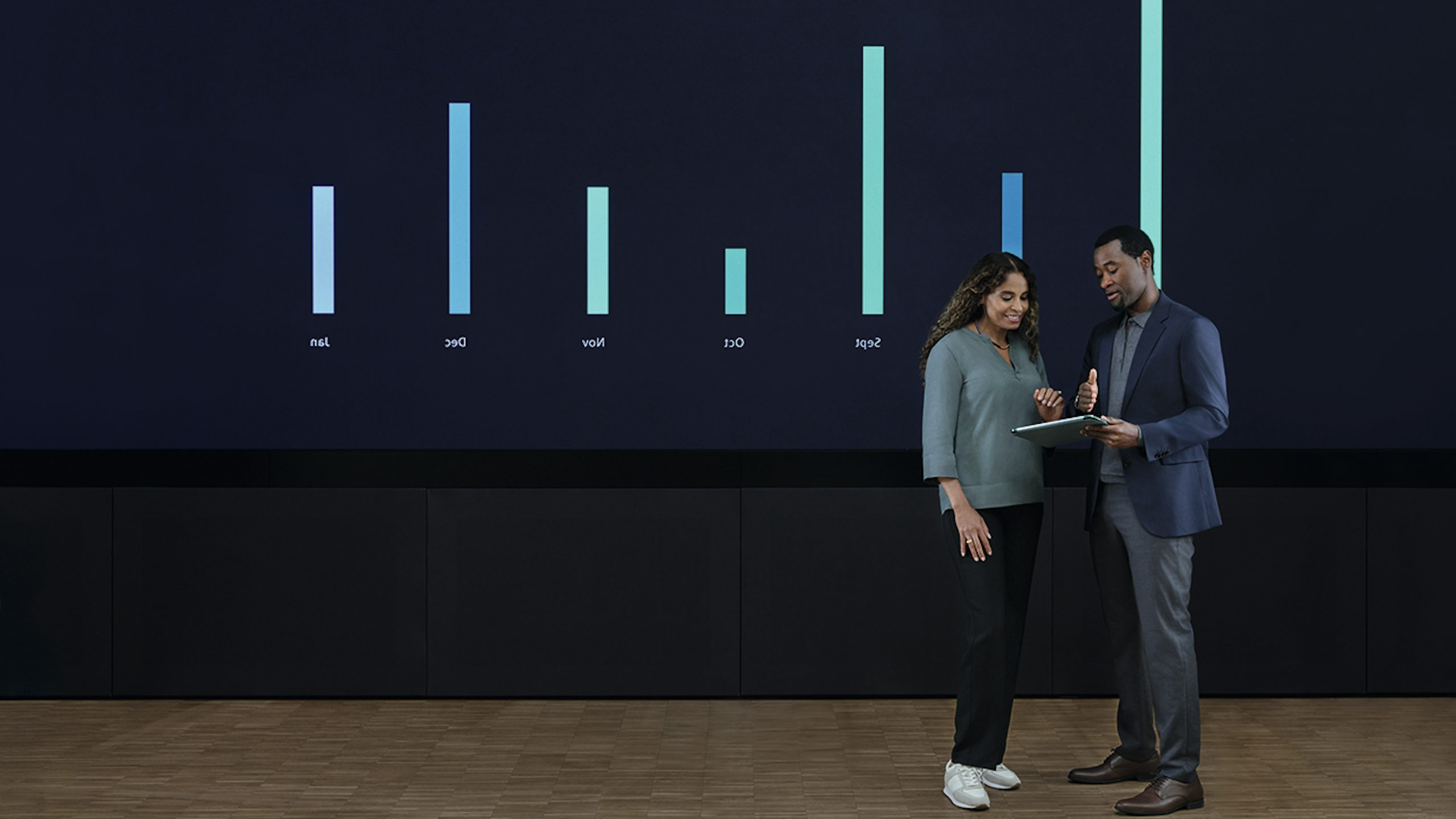 A person is standing in front of a whiteboard with a financial chart and text written on it.