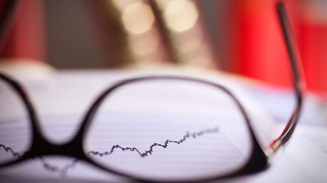 Close up of glasses lying on a share index.