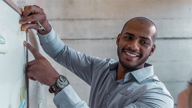 A business meeting with a group of people in a conference room.