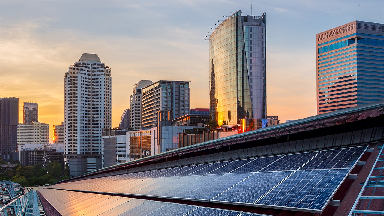 A grid-interactive building with solar panels on its roof.