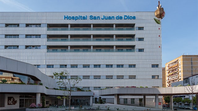 A hospital building with a modern architectural design, featuring glass windows and a clean, professional appearance.