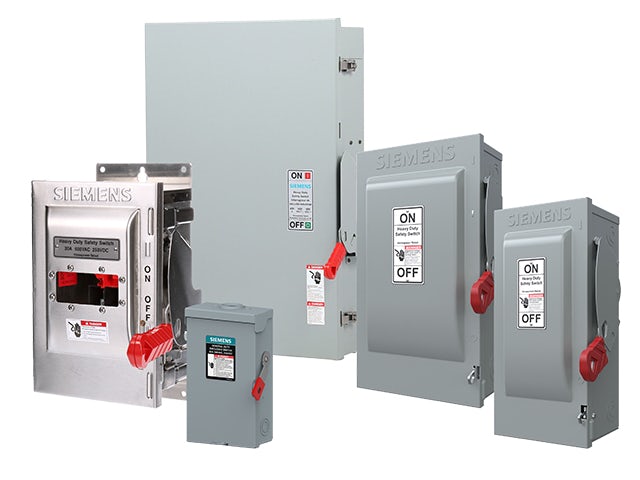 Industrial electrical safety switch with red handle mounted on gray metal enclosure.