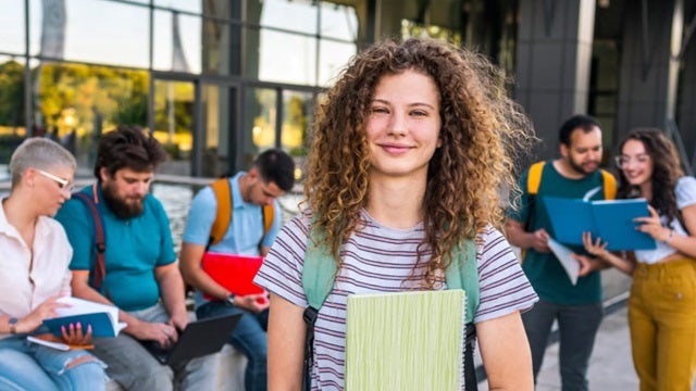 A white paper with a title "Higher Education" and a subtitle "Decarbonization" is displayed on a white background.