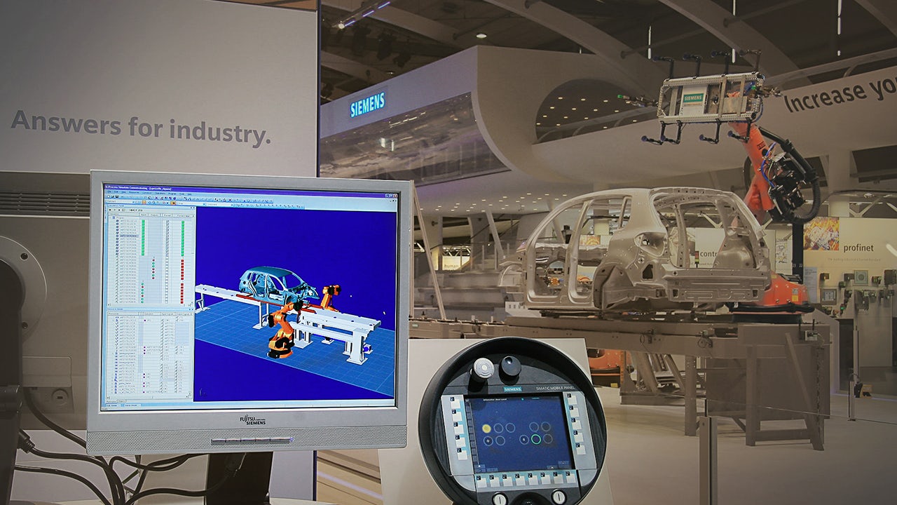 Automotive production of the future – the Siemens booth featuring the Digital Factory at the Hannover Messe, 2008.</br>