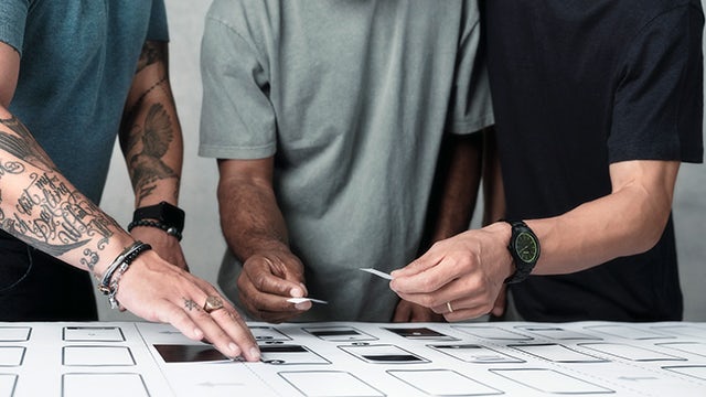 A group of people standing together in a protest or rally, focusing on human rights.
