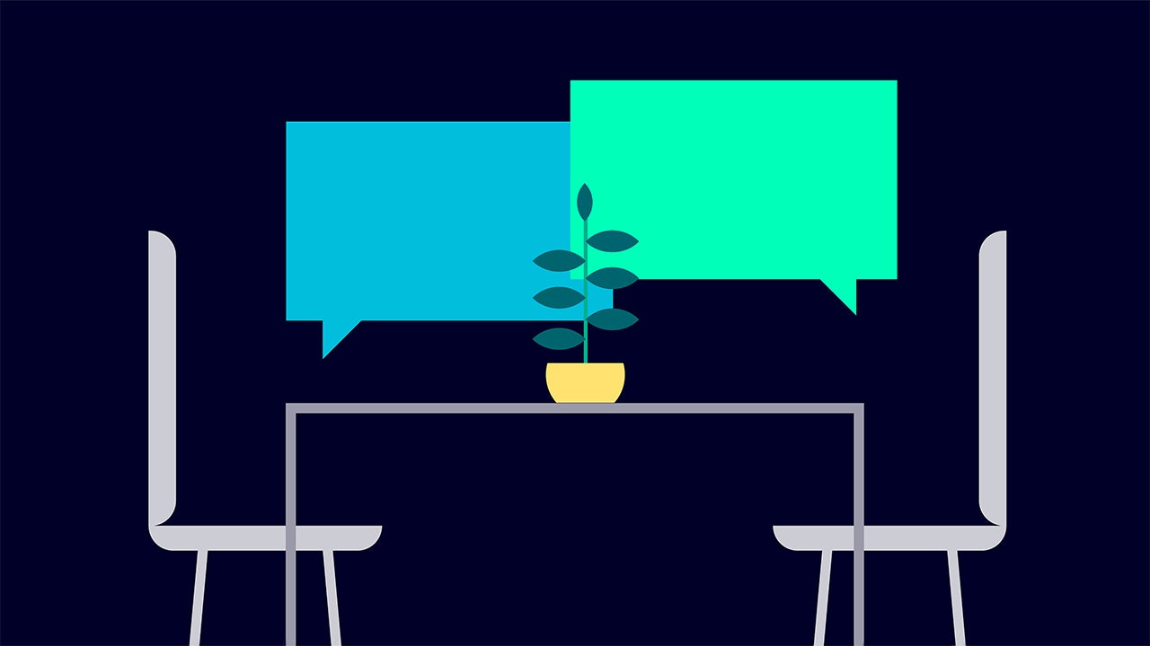 Illustration of two empty chairs facing each other across a table with a potted plant, symbolizing open dialogue and inclusion, with speech bubbles above the table on a dark background.