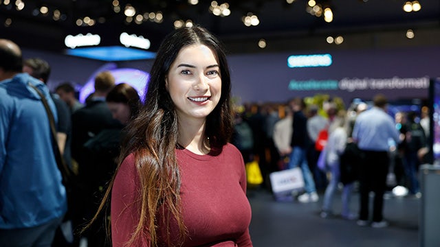 Industrial machinery with robotic arms and conveyor belts in a manufacturing facility.