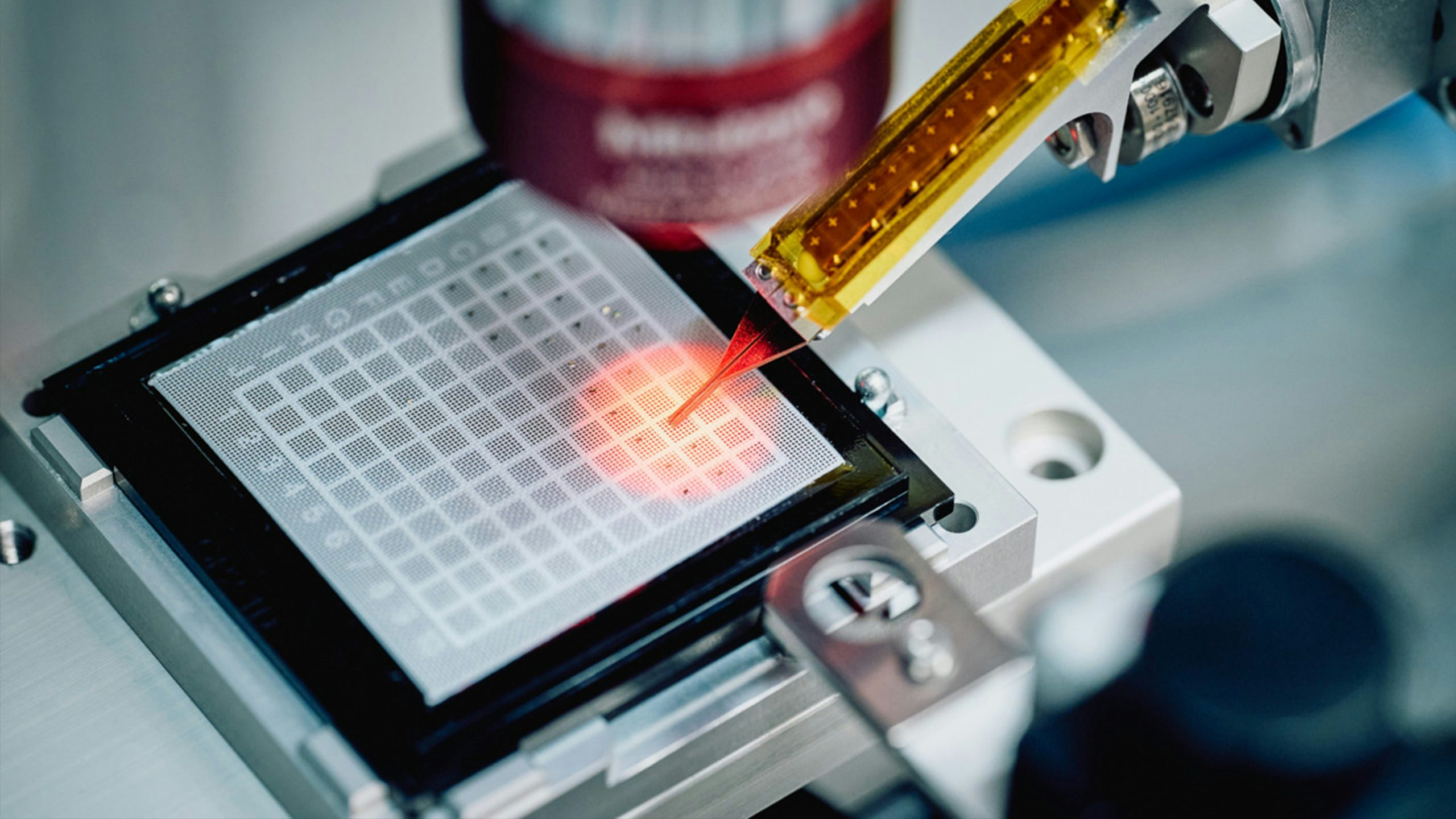 An industrial factory with machinery and workers engaged in production.
