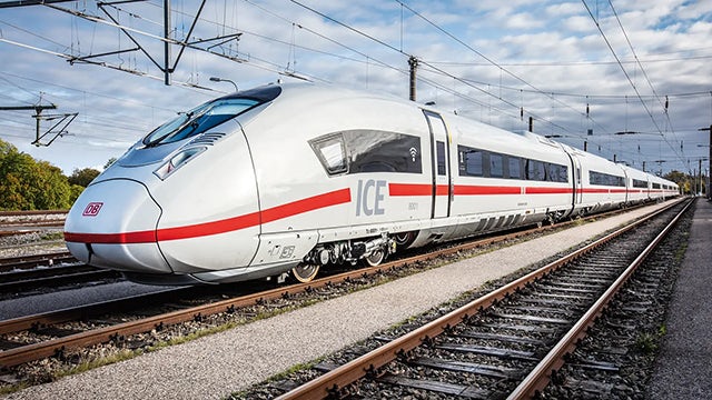 High-speed train on tracks, showcasing Siemens' software upgrade for DB Energie's grid operation improvements in Germany.  