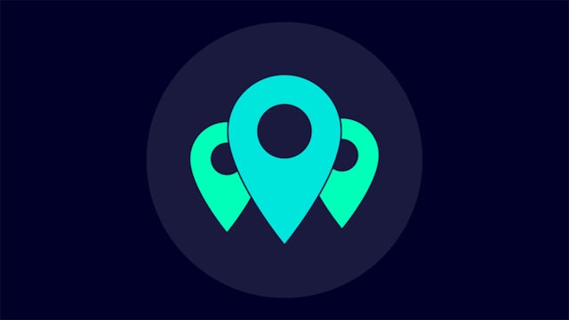 A person in a blue shirt and a white hat is standing in front of a white wall with a blue border.