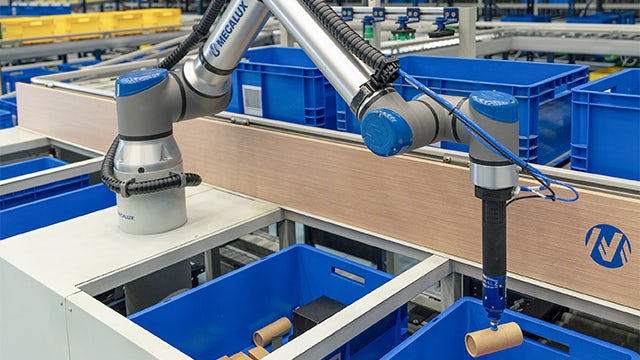 The image shows a warehouse with a robot picking items from a shelf.