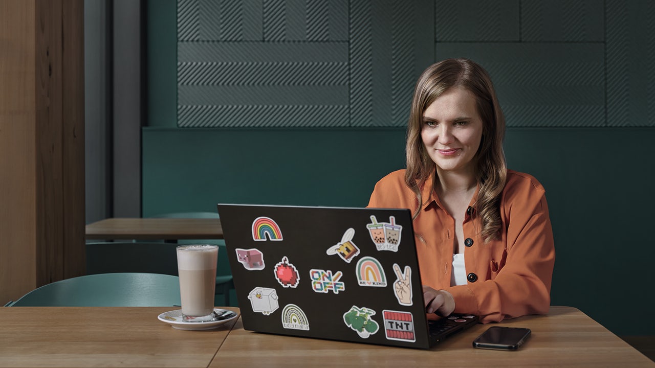 A person is standing in front of a whiteboard with a diagram and text written on it.